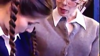 Old And Young Lesbian Couple In Classroom
