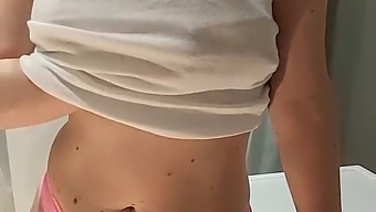 A Blonde Woman Pleasuring Herself In The Bathroom